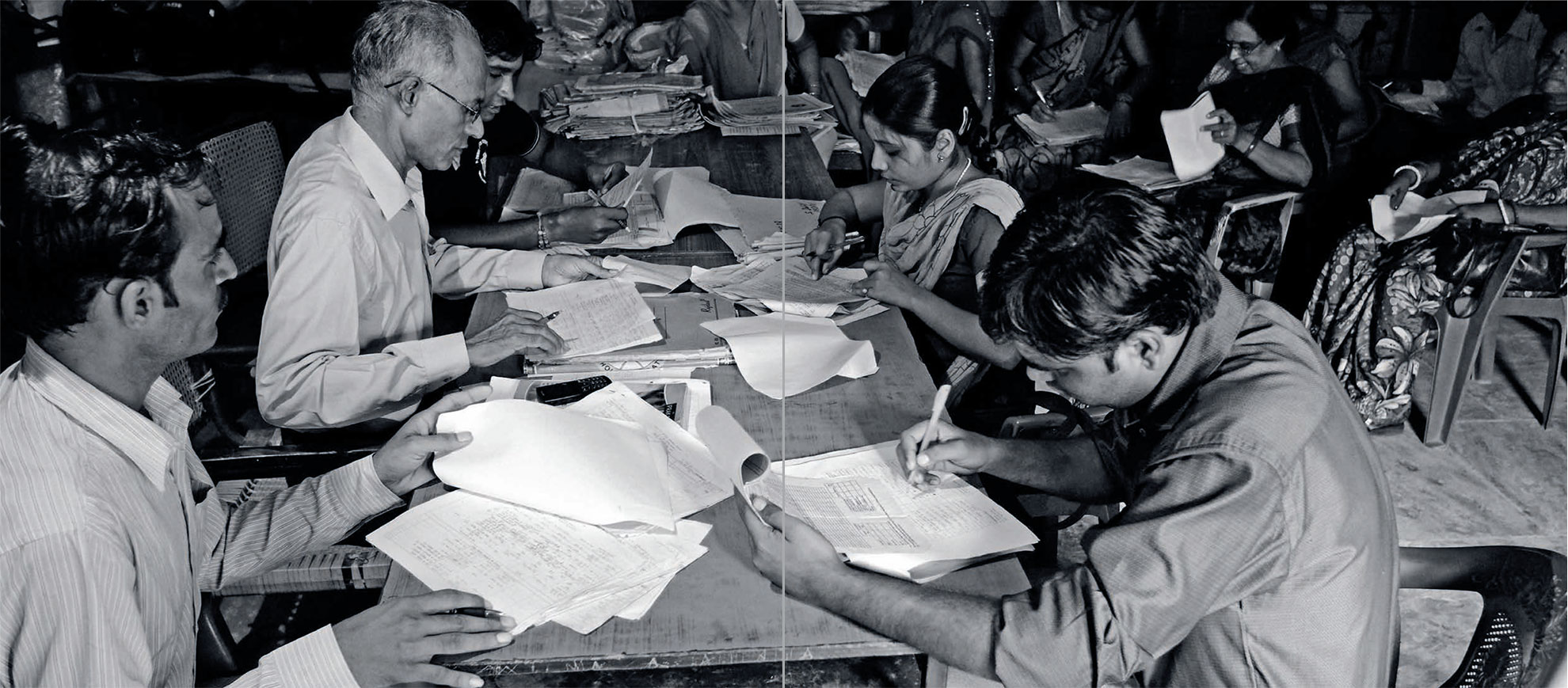 people-filling-forms-signing-unicef