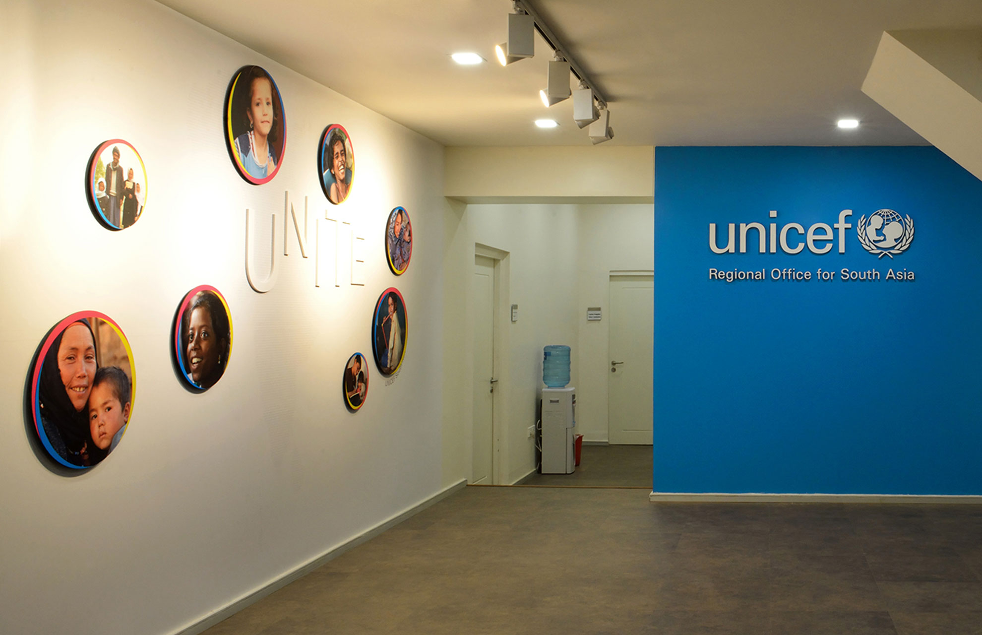 unicef-rosa-environment-branding-circular-wall-tiles-in-hall-blue-united